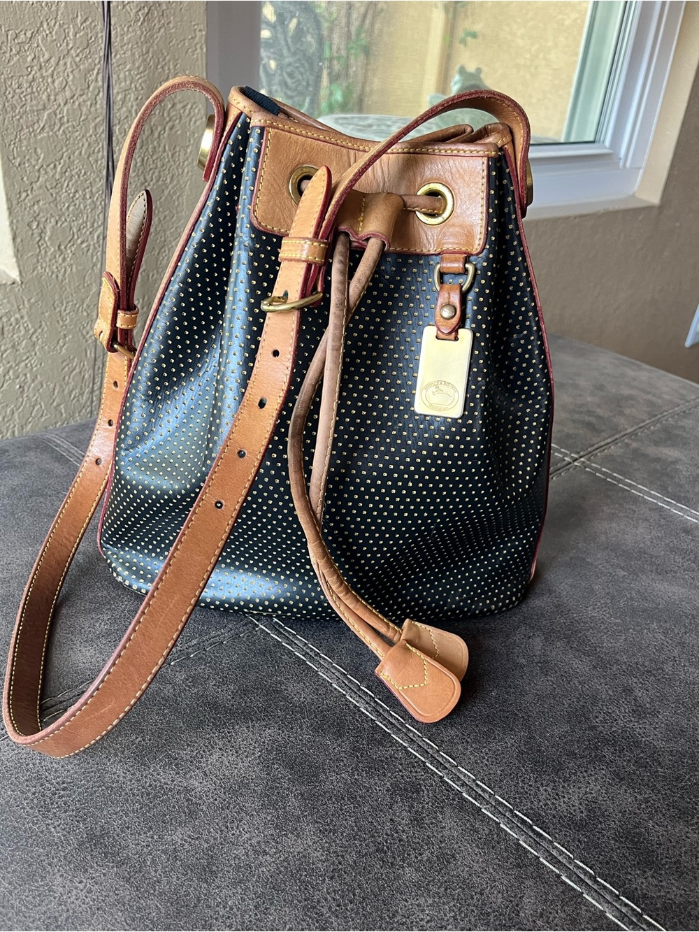 Dooney & Bourke-Vintage Black and Tan Drawstring Bucket Bag with Gold Studs - Picture 10 of 10